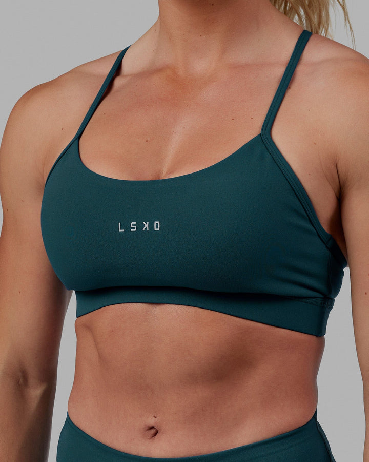 Woman wearing Lift Sports Bra - Tidal Teal