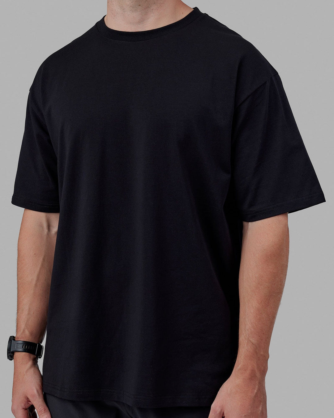 Man wearing Unisex Lifting Club FLXCotton Tee Oversize - Black-White-Yellow