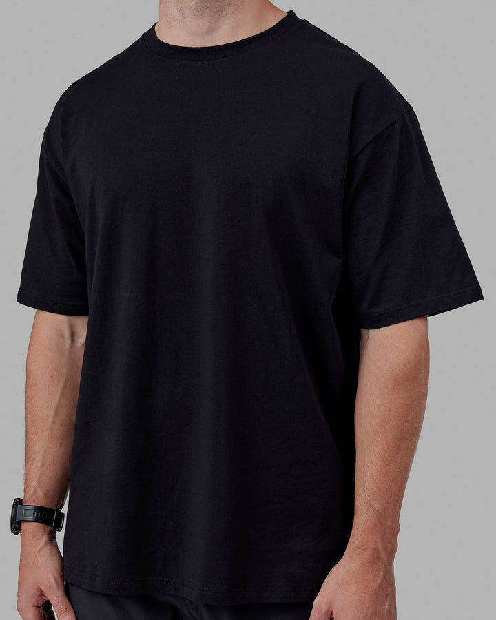 Man wearing Unisex Lifting Club FLXCotton Tee Oversize - Black-White-Yellow
