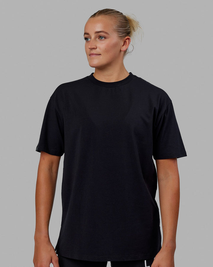 Woman wearing Unisex Lifting Club FLXCotton Tee Oversize - Black-White-Yellow