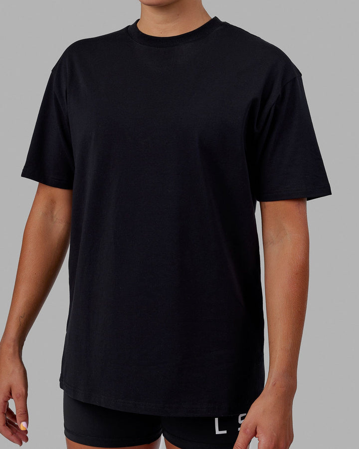 Woman wearing Unisex Lifting Club FLXCotton Tee Oversize - Black-White-Yellow