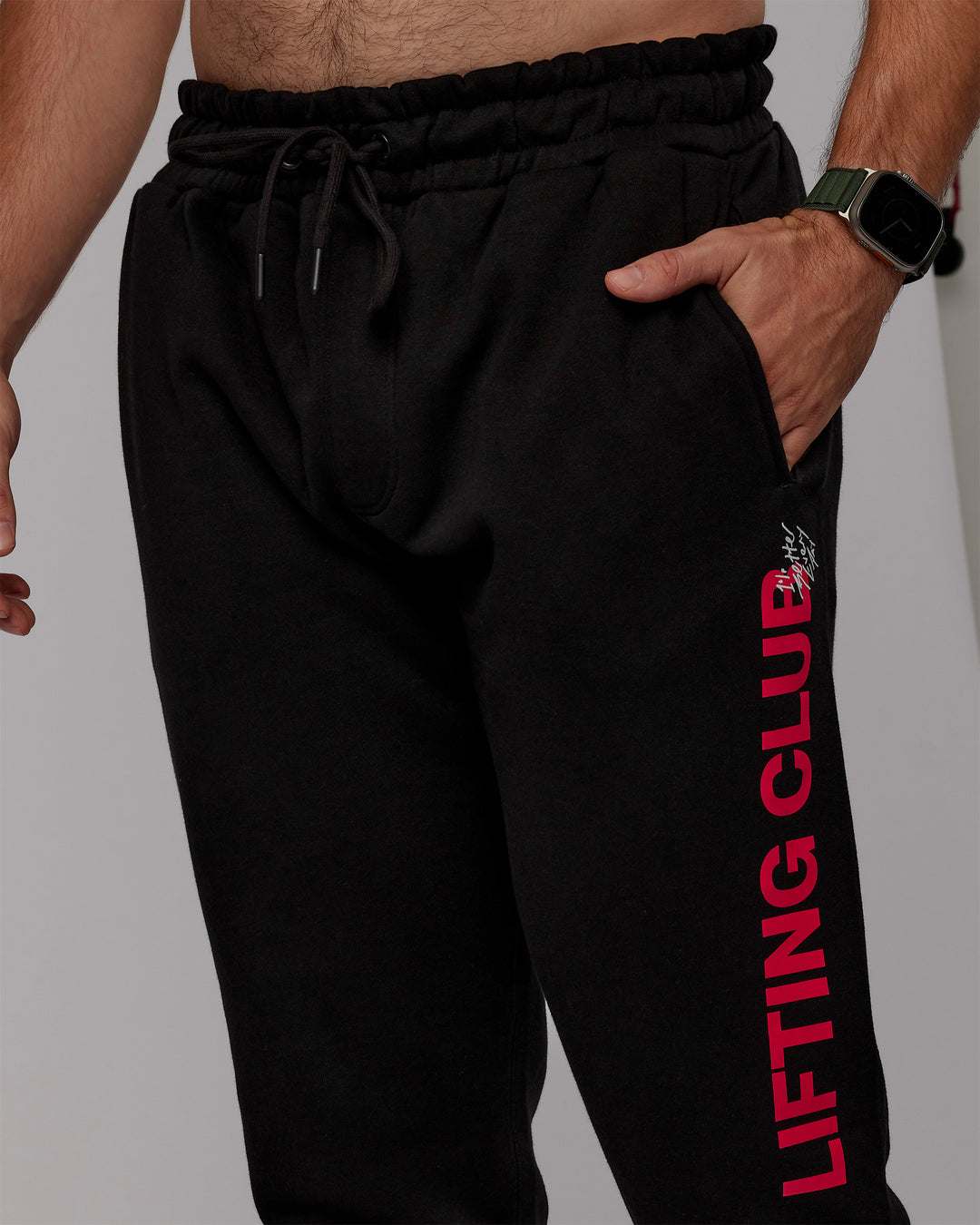 Man wearing Lifting Club Track Pants - Black-Red