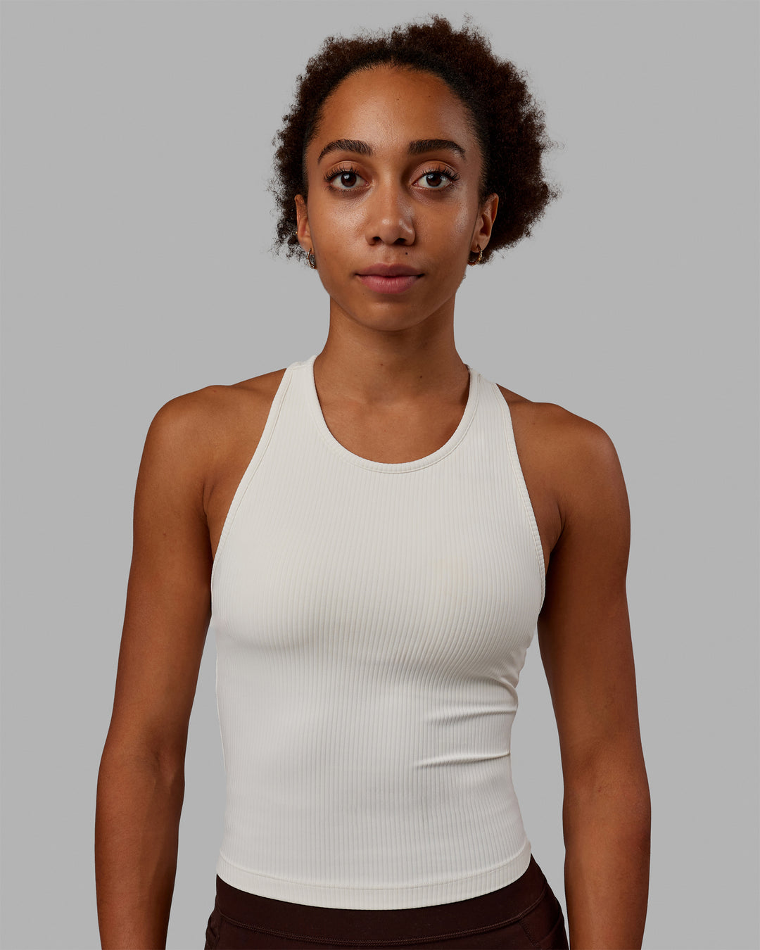 Woman wearing Luxe Ribbed Flow Shelf Bra Performance Tank - Off White