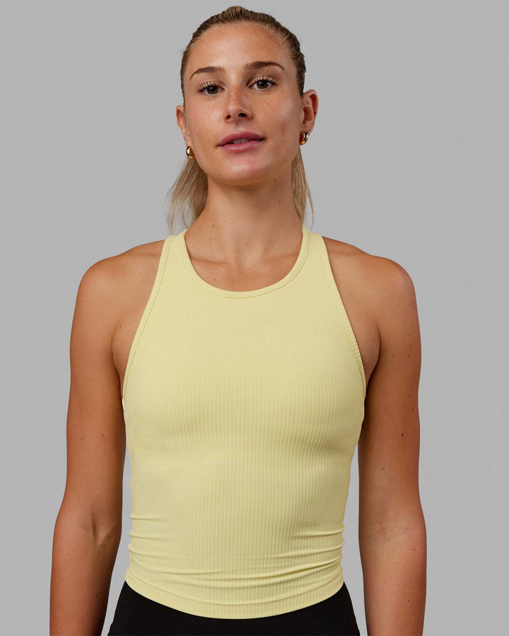 Woman wearing Luxe Ribbed Flow Shelf Bra Performance Tank - Lemon Fizz