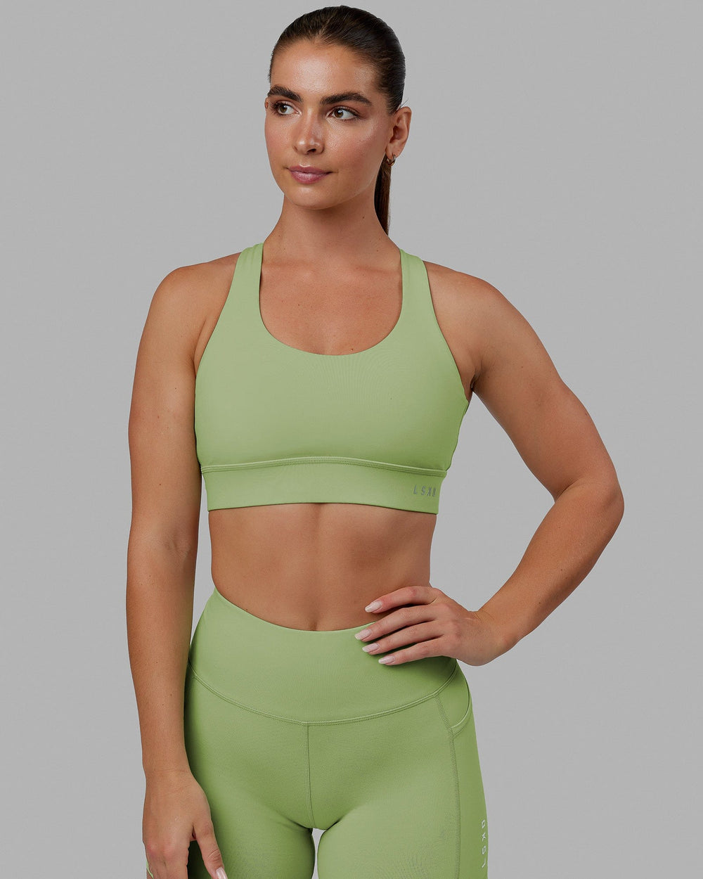Woman wearing MVP 2.0 Sports Bra - Green Fig