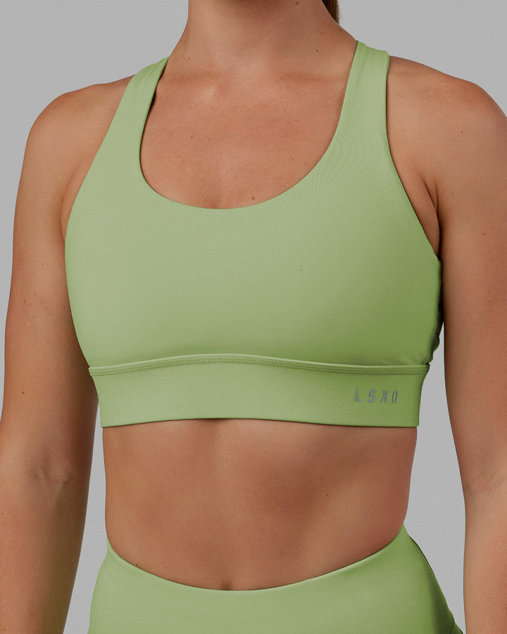 Woman wearing MVP 2.0 Sports Bra - Green Fig
