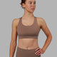Woman wearing MVP 2.0 Sports Bra - Deep Taupe