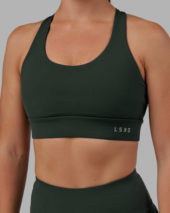 Woman wearing MVP 2.0 Sports Bra - Vital Green