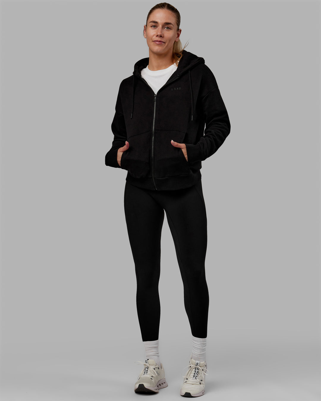 Woman wearing MVP Zip Through Hoodie - Black