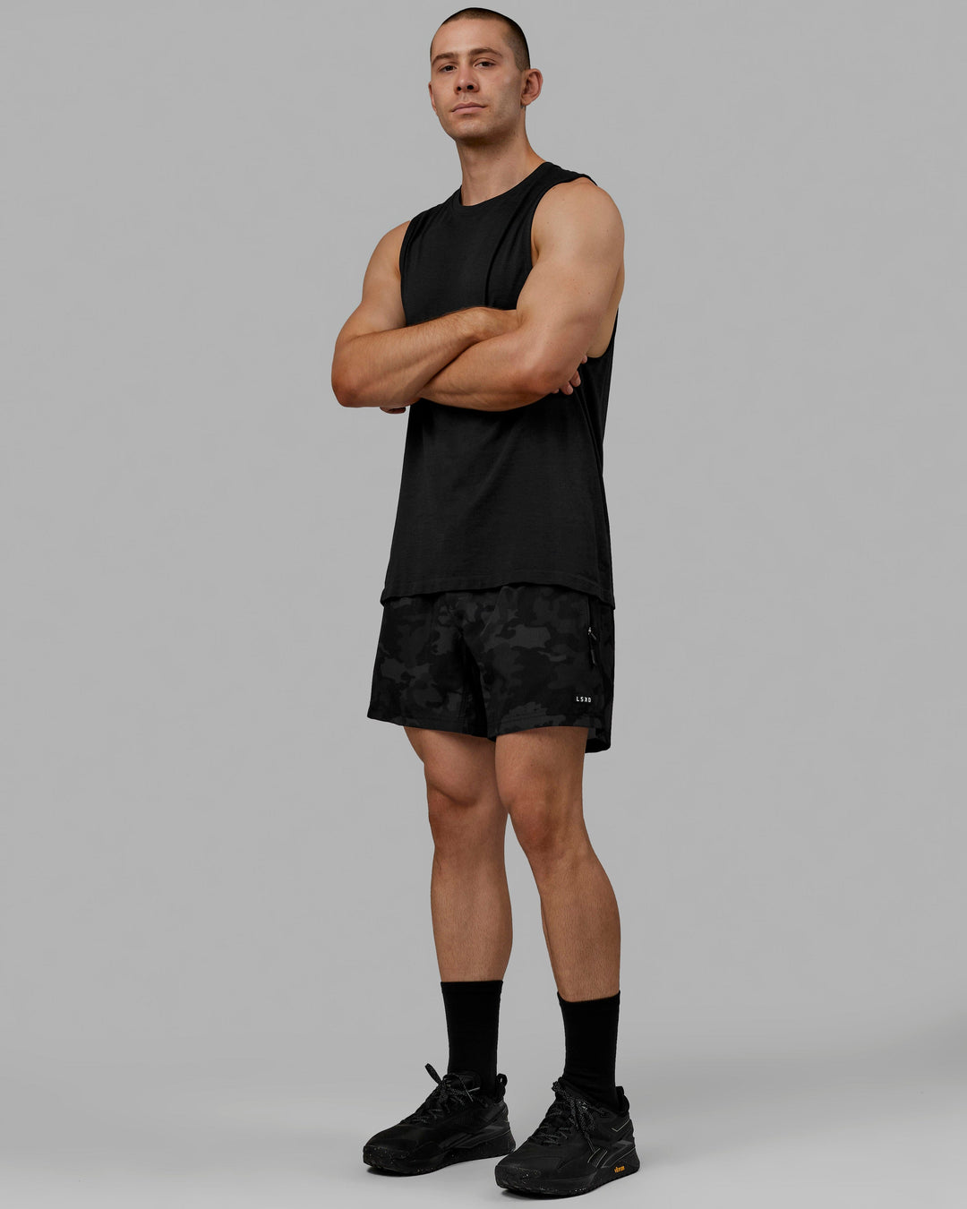 Man wearing AeroFLX+ Seamless Muscle Tank - Black Marl