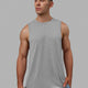 Man wearing AeroFLX+ Seamless Muscle Tank - Lt Grey Marl