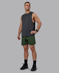 Man wearing AeroFLX+ Seamless Muscle Tank - Pirate Black Marl