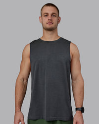 Man wearing AeroFLX+ Seamless Muscle Tank - Pirate Black Marl