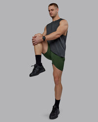 Man wearing AeroFLX+ Seamless Muscle Tank - Pirate Black Marl