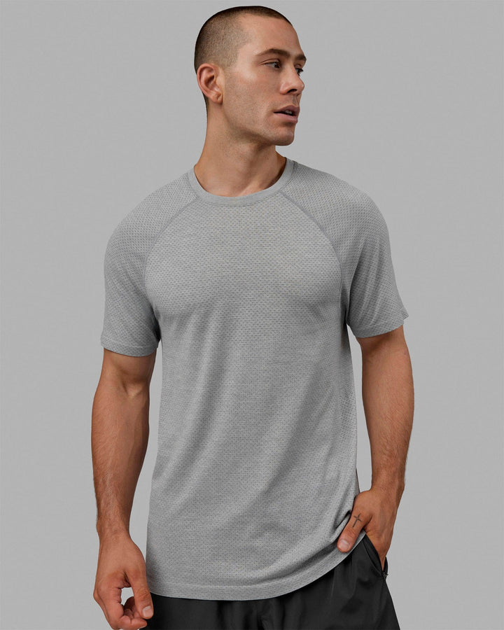 Man wearing AeroFLX+ Seamless Tee - Light Grey Marl
