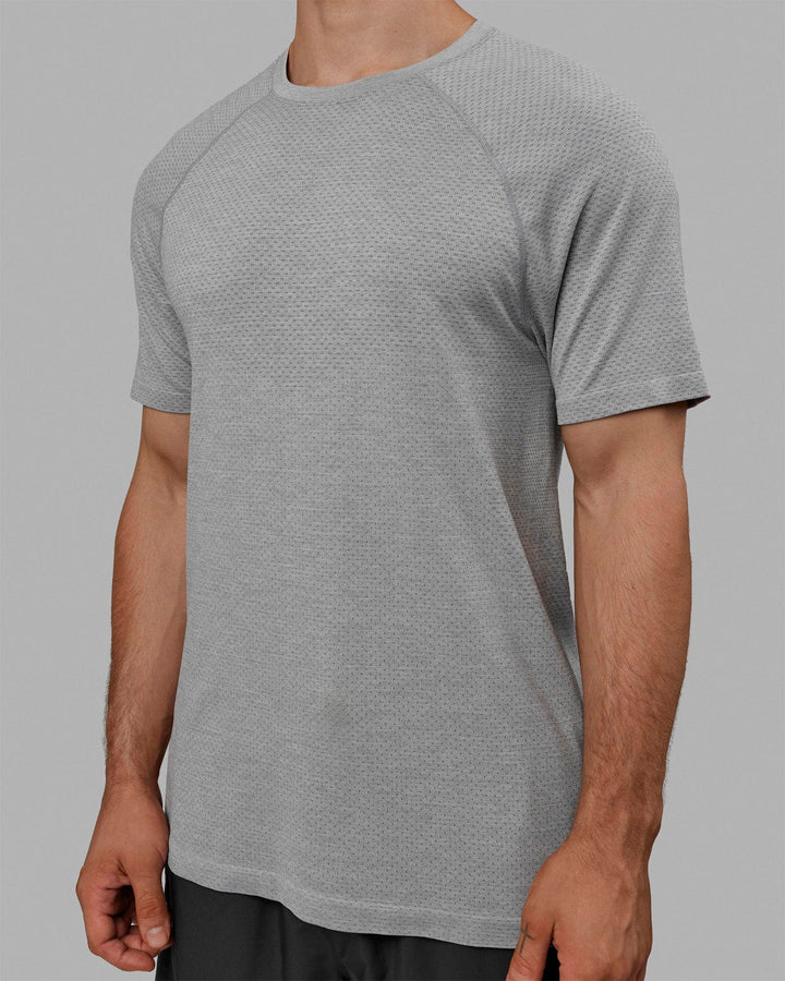 Man wearing AeroFLX+ Seamless Tee - Light Grey Marl
