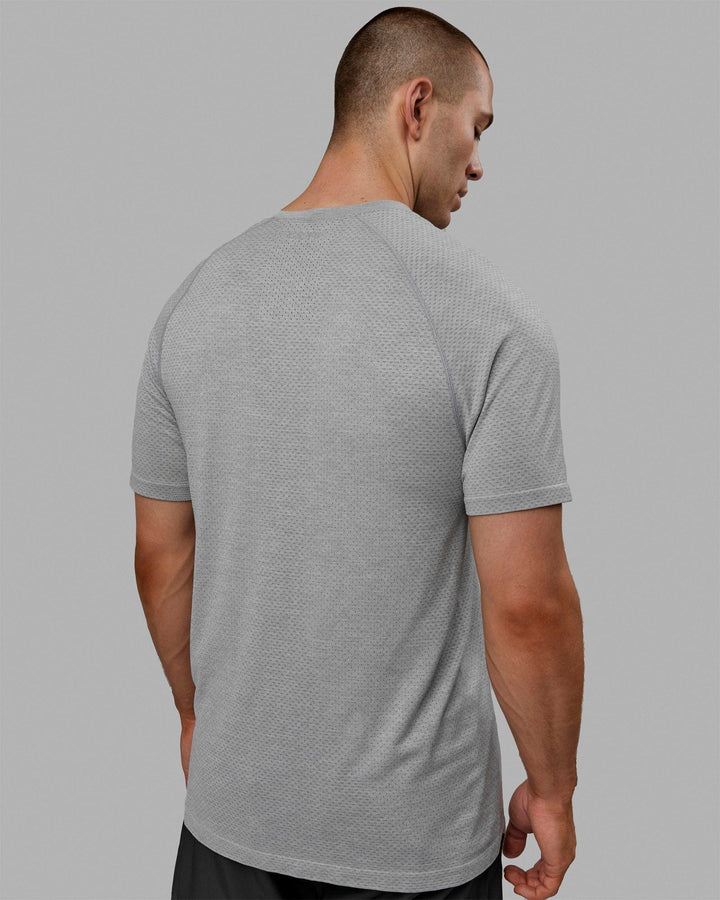 Man wearing AeroFLX+ Seamless Tee - Light Grey Marl
