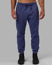 Man wearing Athlete ForgedFleece Zip Track Pants - Future Dusk