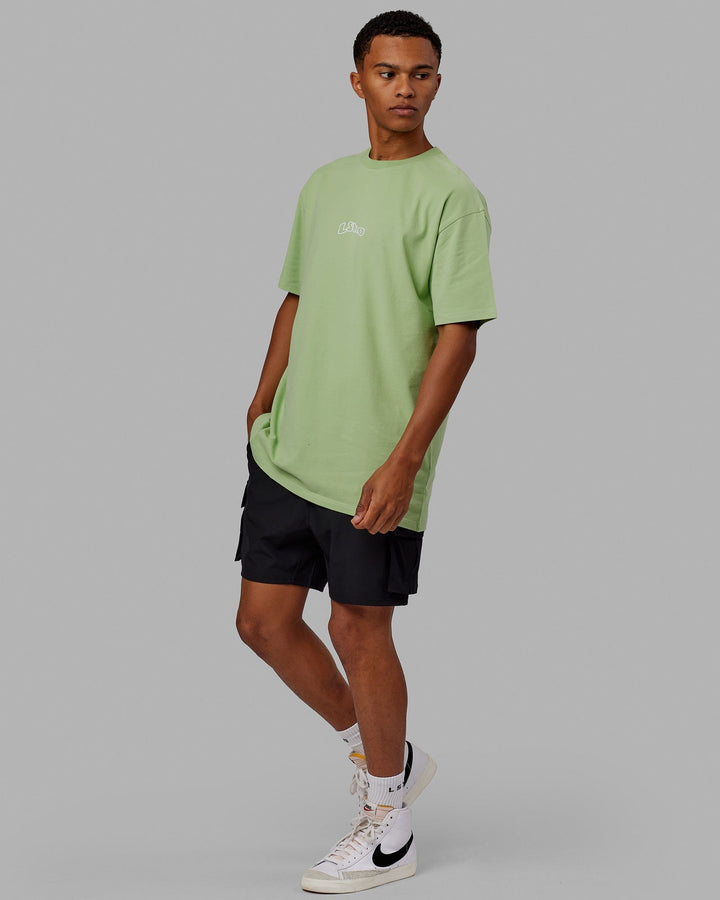 Man wearing Mad Happy Heavyweight Longline Tee Oversize - Green Fig