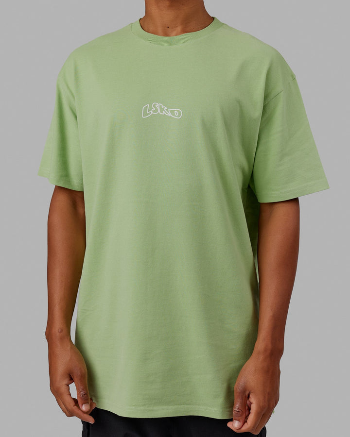 Man wearing Mad Happy Heavyweight Longline Tee Oversize - Green Fig