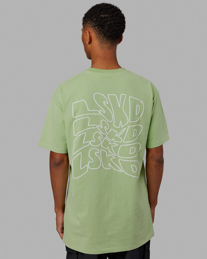 Man wearing Mad Happy Heavyweight Longline Tee Oversize - Green Fig