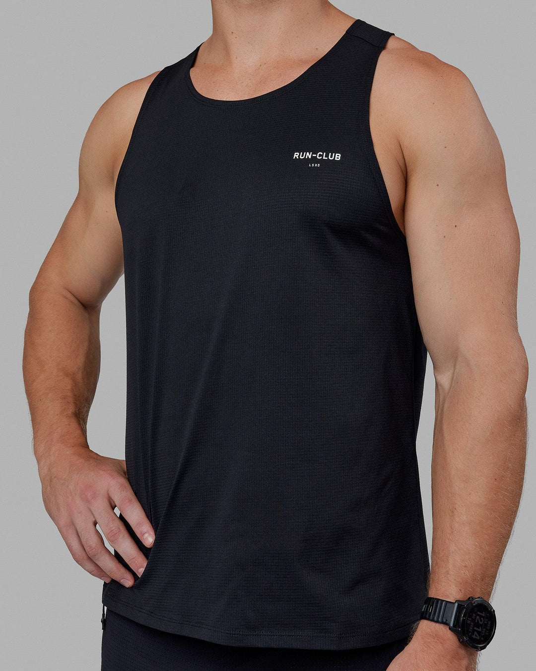Man wearing RUN–CLUB Performance Tank - Black