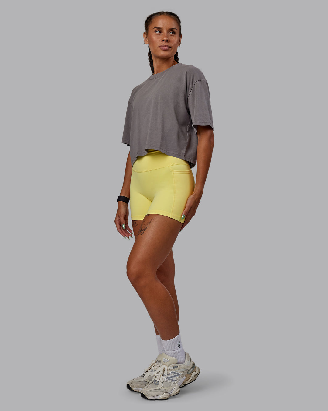 Woman wearing Miami 2025 FLXCotton Cropped Tee - Storm Front-Lemon Fizz