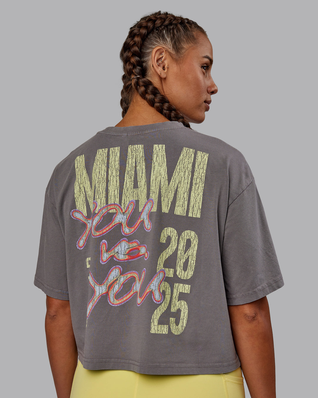 Woman wearing Miami 2025 FLXCotton Cropped Tee - Storm Front-Lemon Fizz