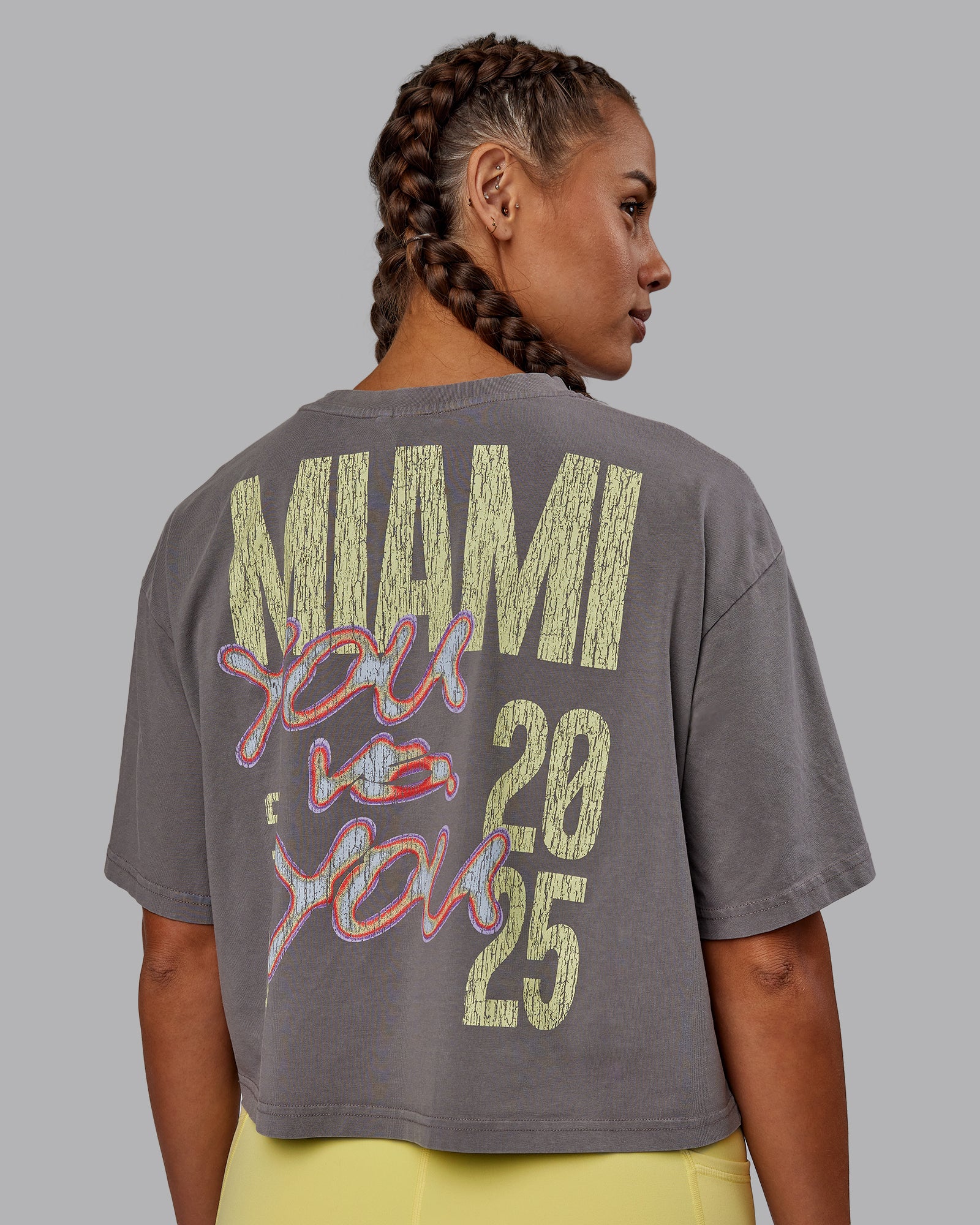 Woman wearing Miami 2025 FLXCotton Cropped Tee - Storm Front-Lemon Fizz