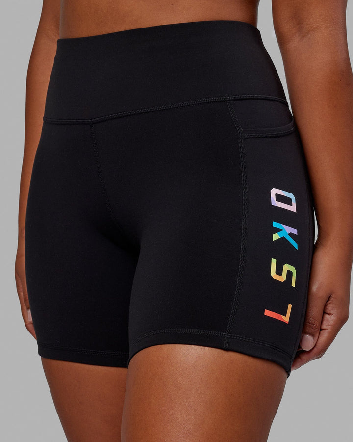 Woman wearing Rep Mid Short Tight - Pride-Black