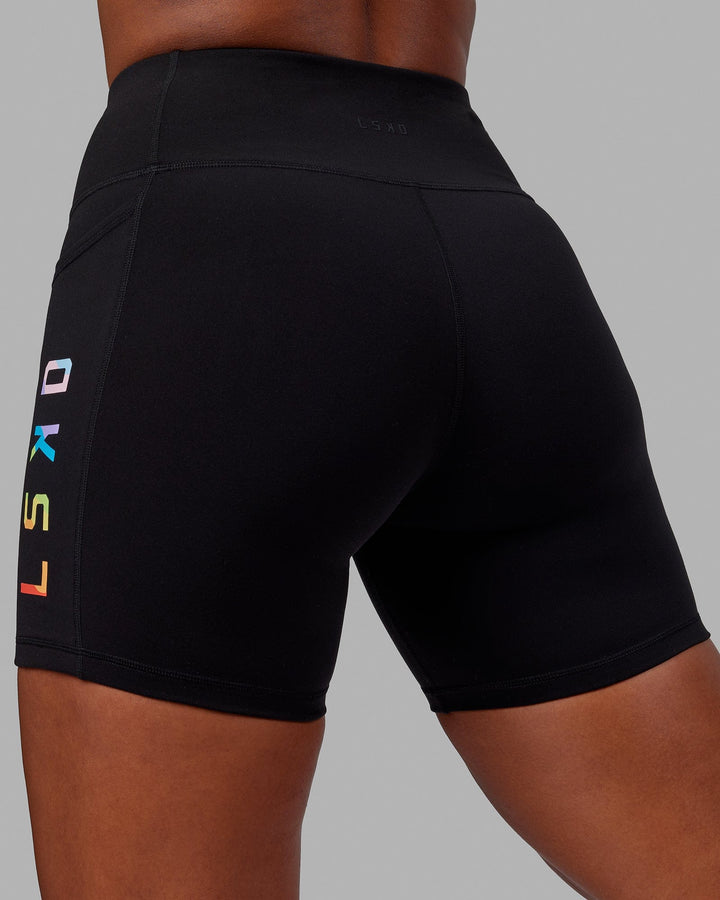 Woman wearing Rep Mid Short Tight - Pride-Black