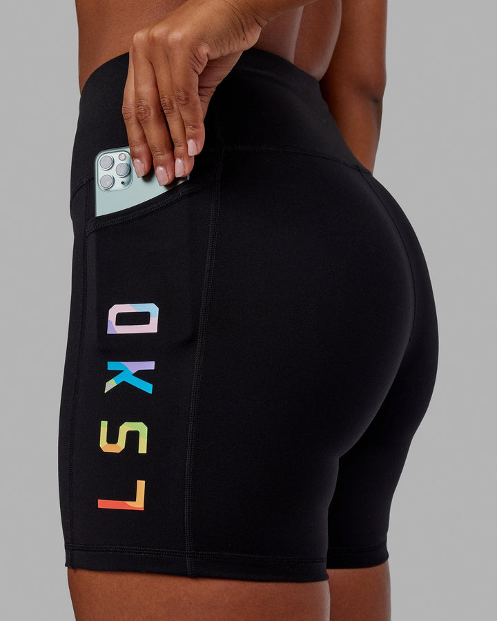 Woman wearing Rep Mid Short Tight - Pride-Black