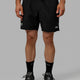 Man wearing Millenium 7" Shorts - Black