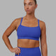 Woman wearing Momentum Ribbed Sports Bra - Power Cobalt