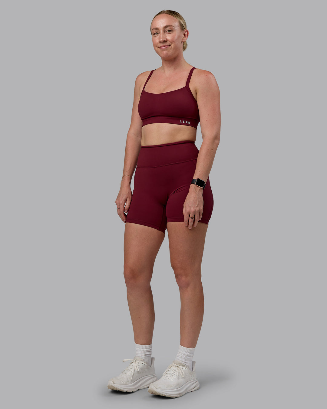 Woman wearing Momentum Sports Bra (D/DD/E) - Cordovan
