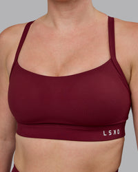 Woman wearing Momentum Sports Bra (D/DD/E) - Cordovan