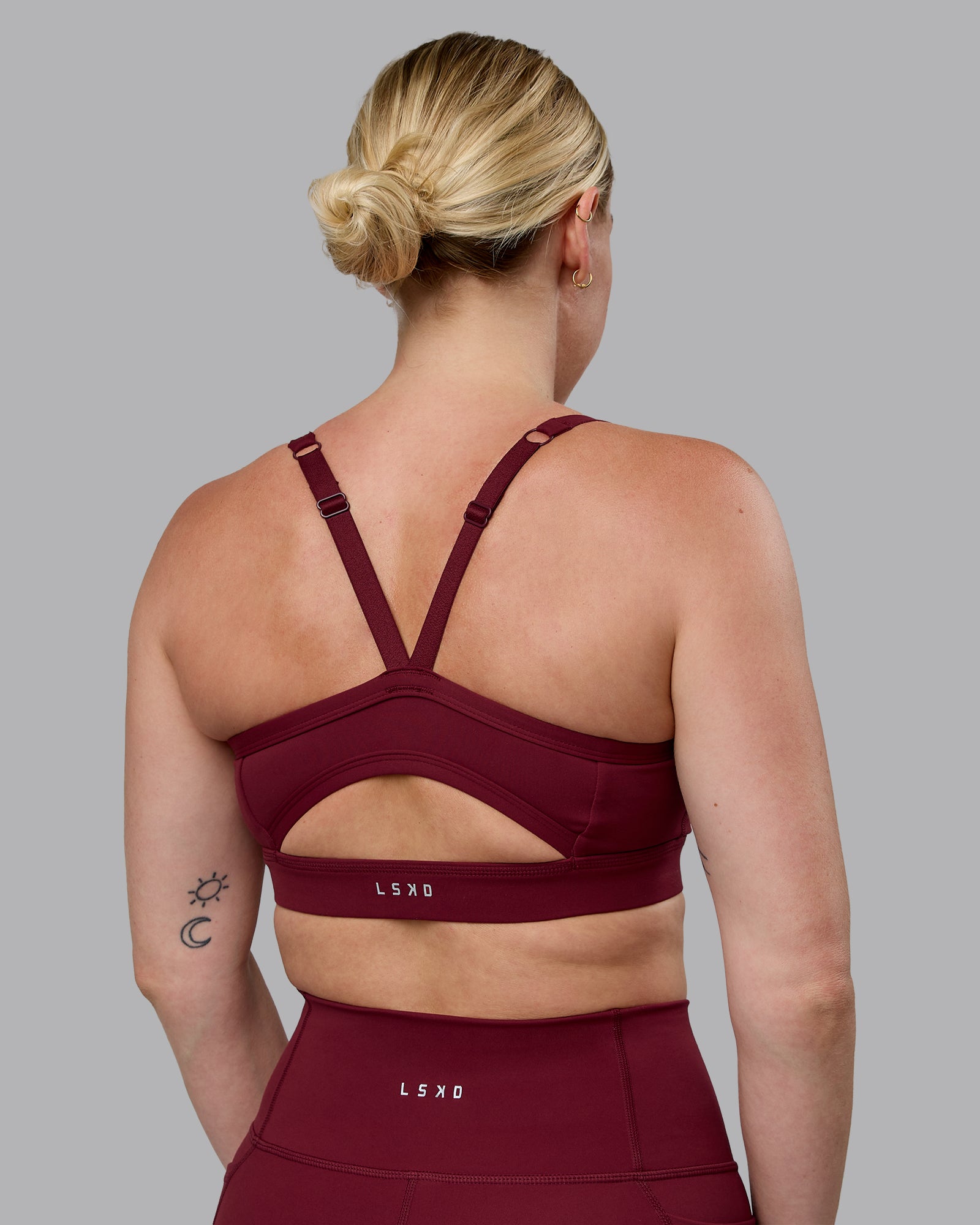Woman wearing Momentum Sports Bra (D/DD/E) - Cordovan