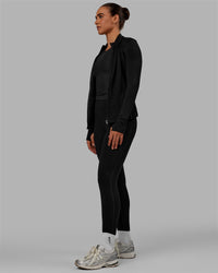 Woman wearing Motion Ultra High-Rise Thermal Full Length Legging - Black