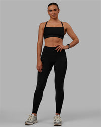 Woman wearing Motion Ultra High-Rise Thermal Full Length Legging - Black