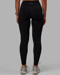 Woman wearing Motion Ultra High-Rise Thermal Full Length Legging - Black