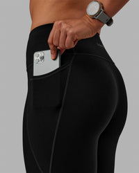 Woman wearing Motion Ultra High-Rise Thermal Full Length Legging - Black