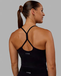 Woman wearing Movement Active Tank - Black | Thumbnail Index: 2