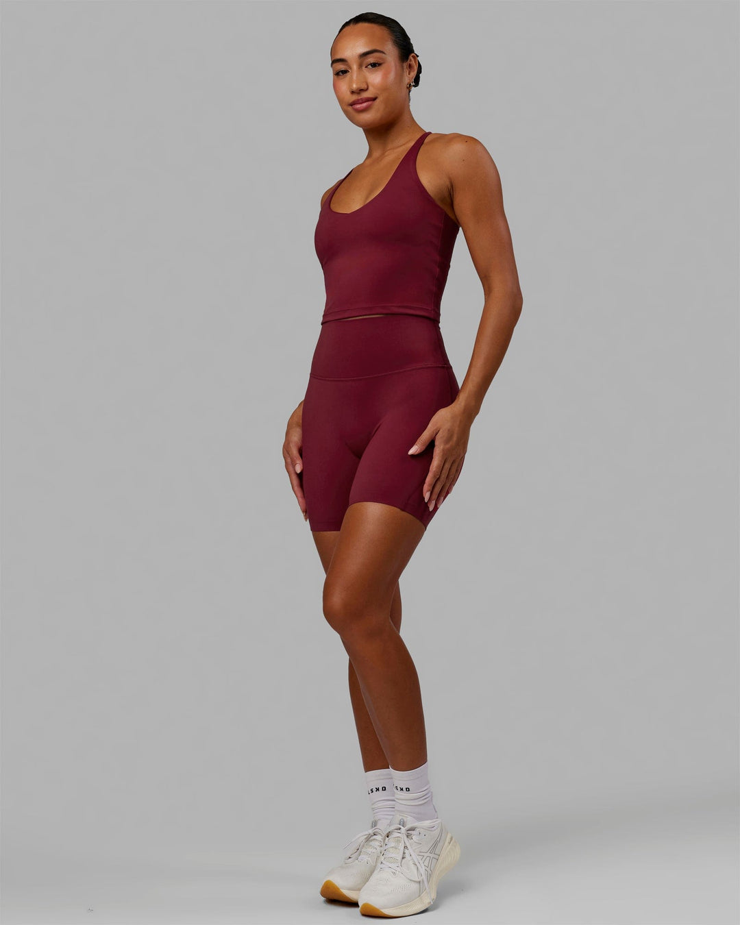 Woman wearing Movement Active Tank - Cranberry