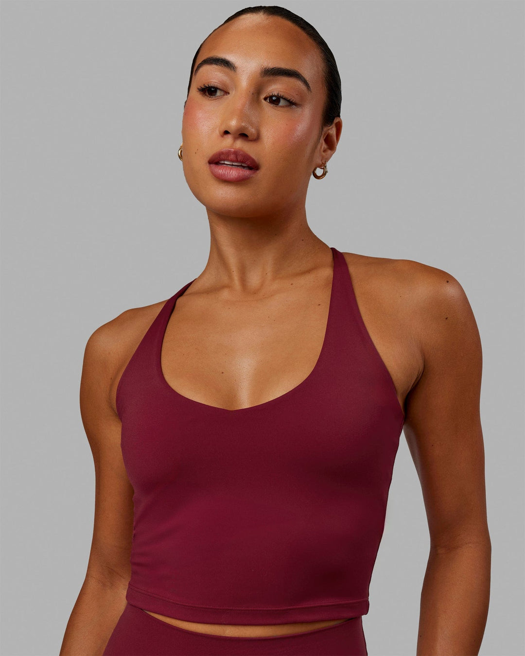 Woman wearing Movement Active Tank - Cranberry
