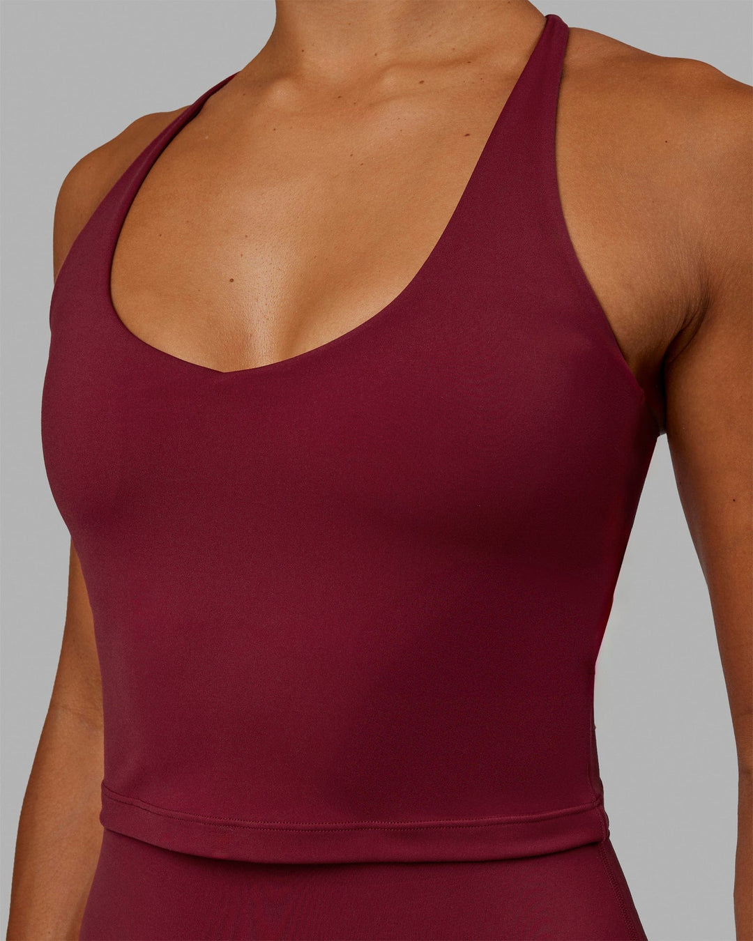 Woman wearing Movement Active Tank - Cranberry