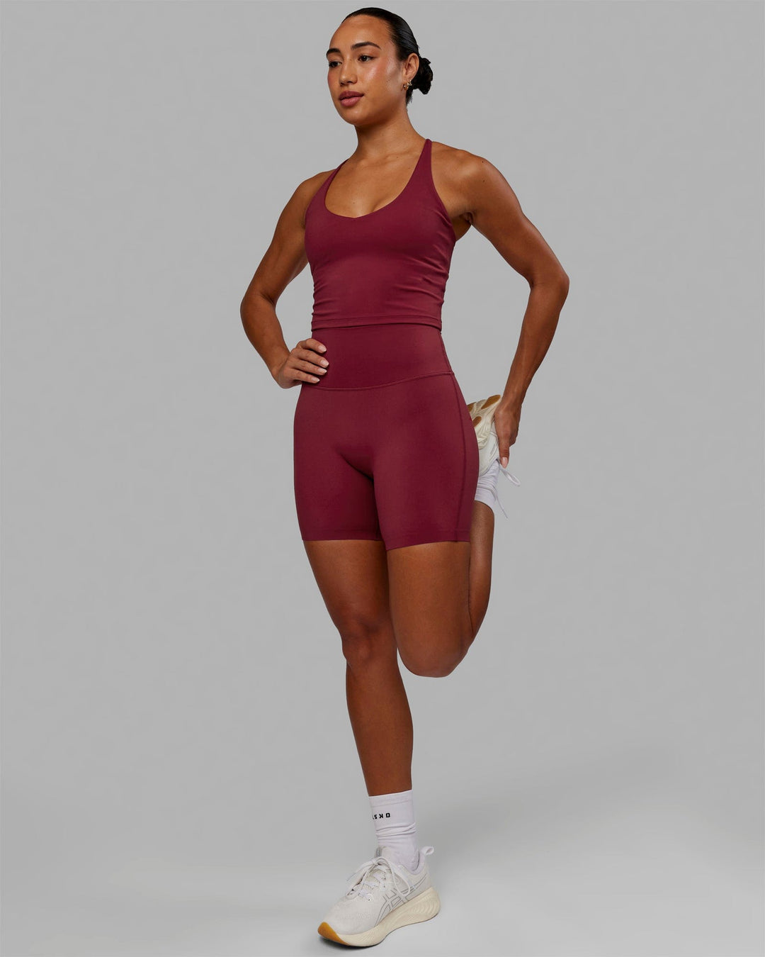 Woman wearing Movement Active Tank - Cranberry