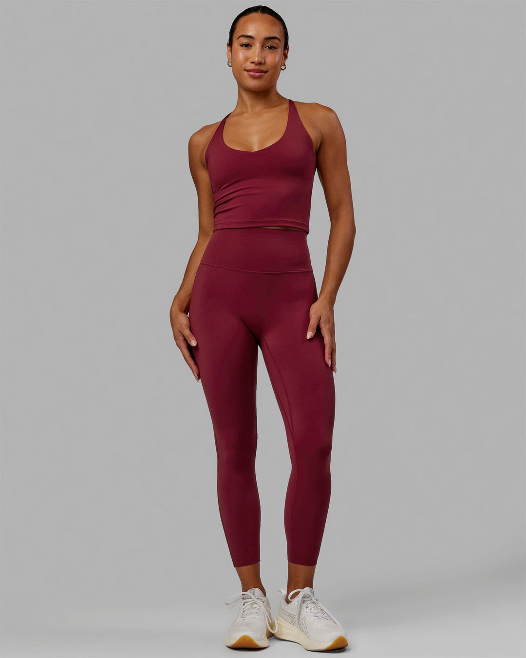 Woman wearing Movement Active Tank - Cranberry