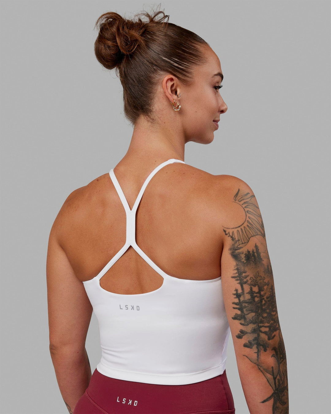 Woman wearing Movement Active Tank - White