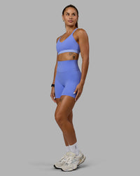 Woman wearing Nexus Sports Bra - Indulgent Blue