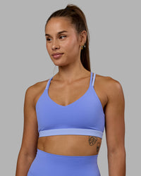 Woman wearing Nexus Sports Bra - Indulgent Blue